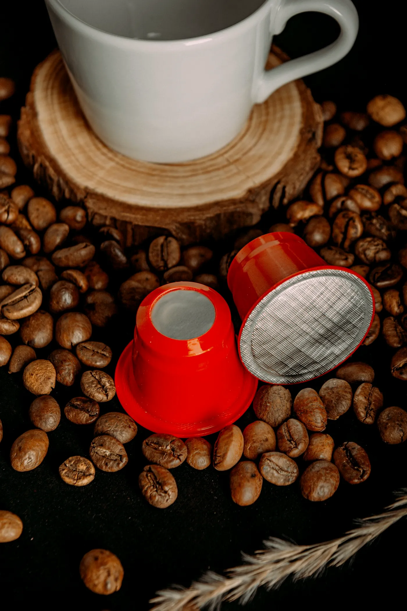 Espresso capsule on roasted coffee beans