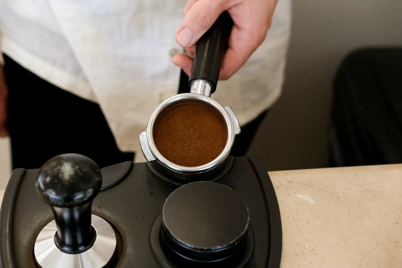 Ground espresso coffee in a portafilter